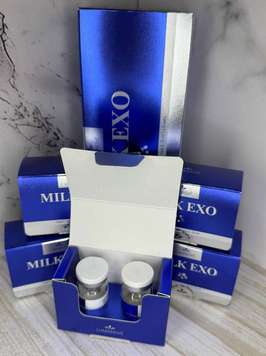 Milk EXO product packaging with blue and white design on a marble surface