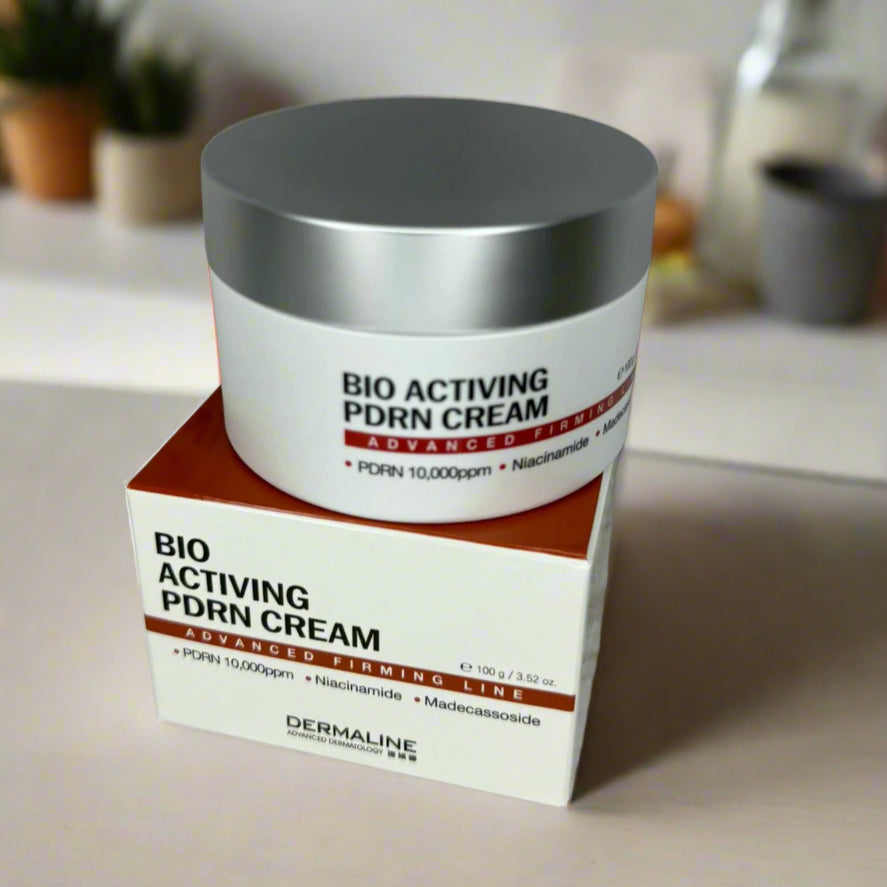 Bio Activating PDRN Cream jar and box on a marble surface